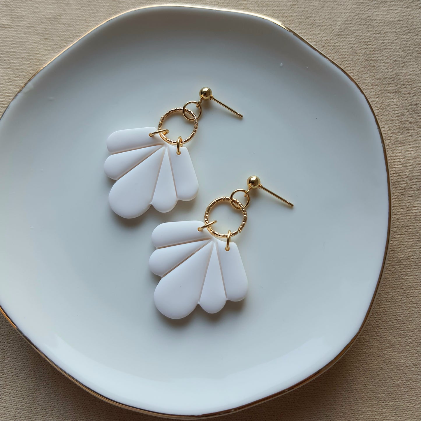 White fan dangle earrings
