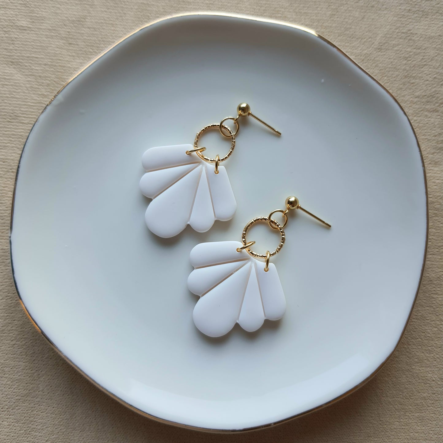 White fan dangle earrings