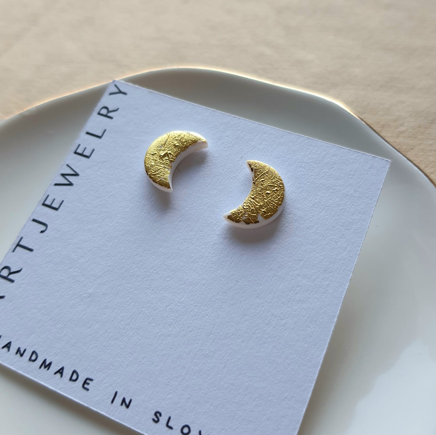 White moon with golden flakes stud earrings