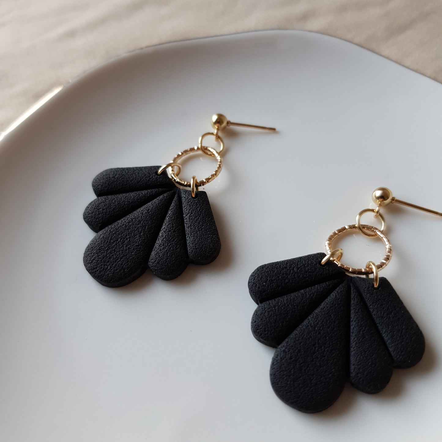 Black fan dangle earrings