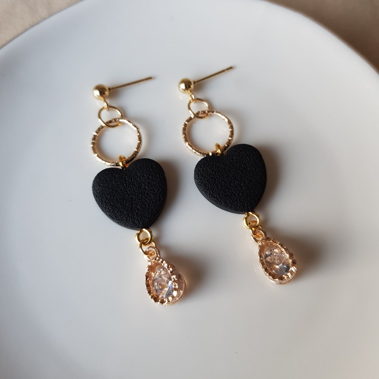Black heart dangle earrings