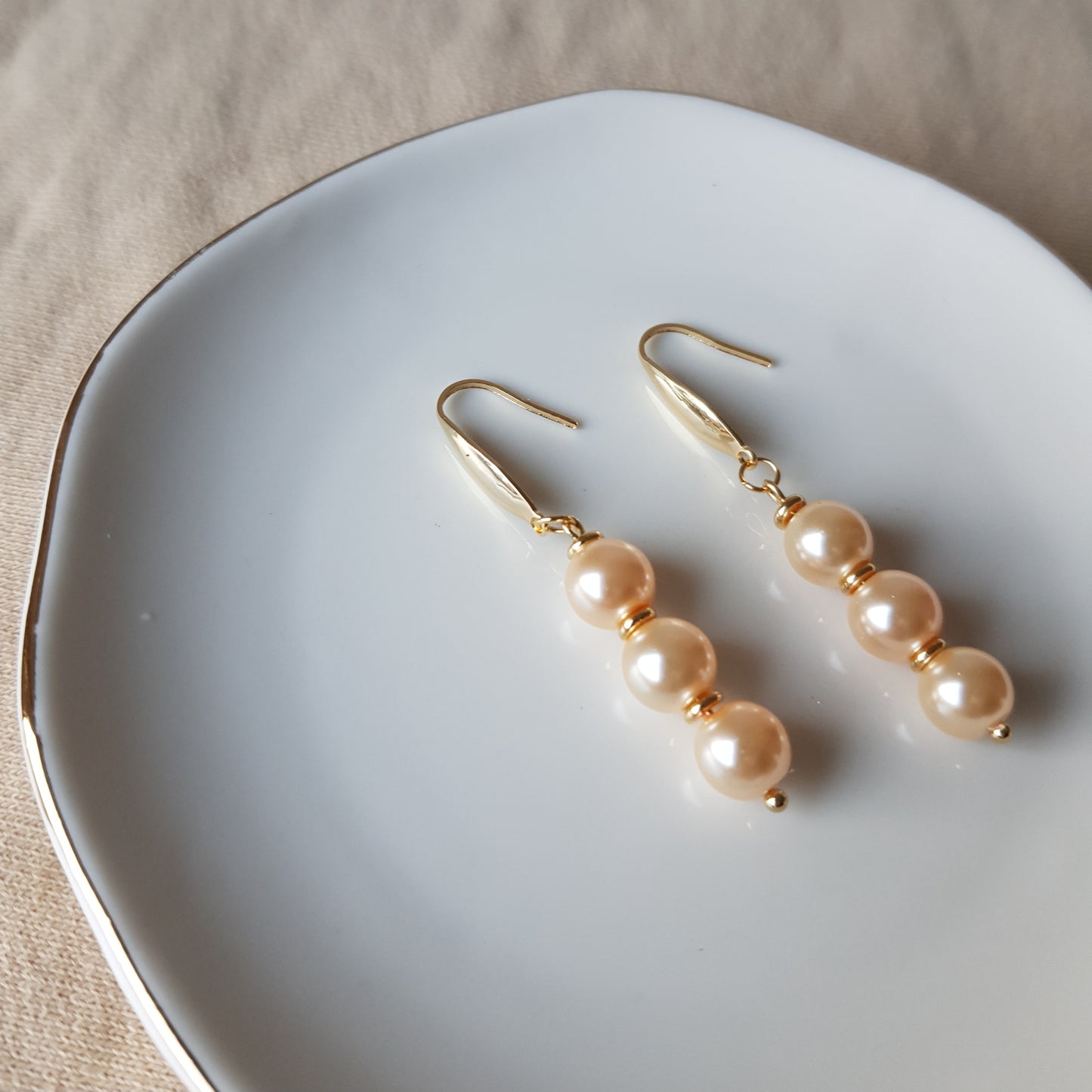 Salmon pearl bead dangle earrings