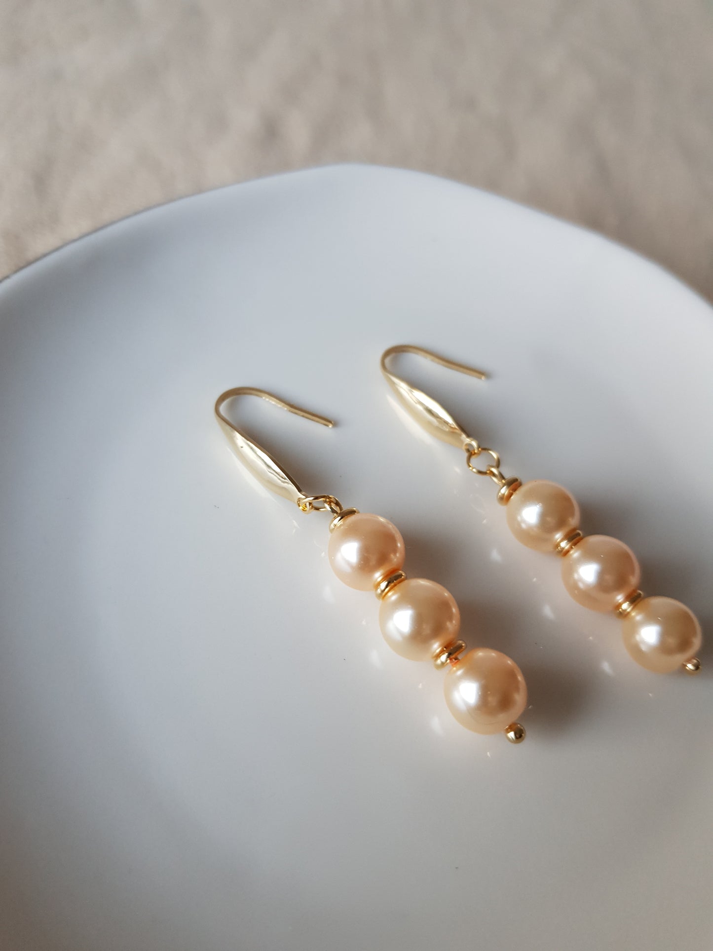 Salmon pearl bead dangle earrings