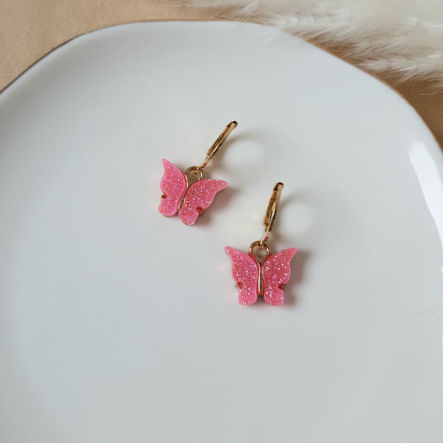 Sparkly pink butterfly earrings
