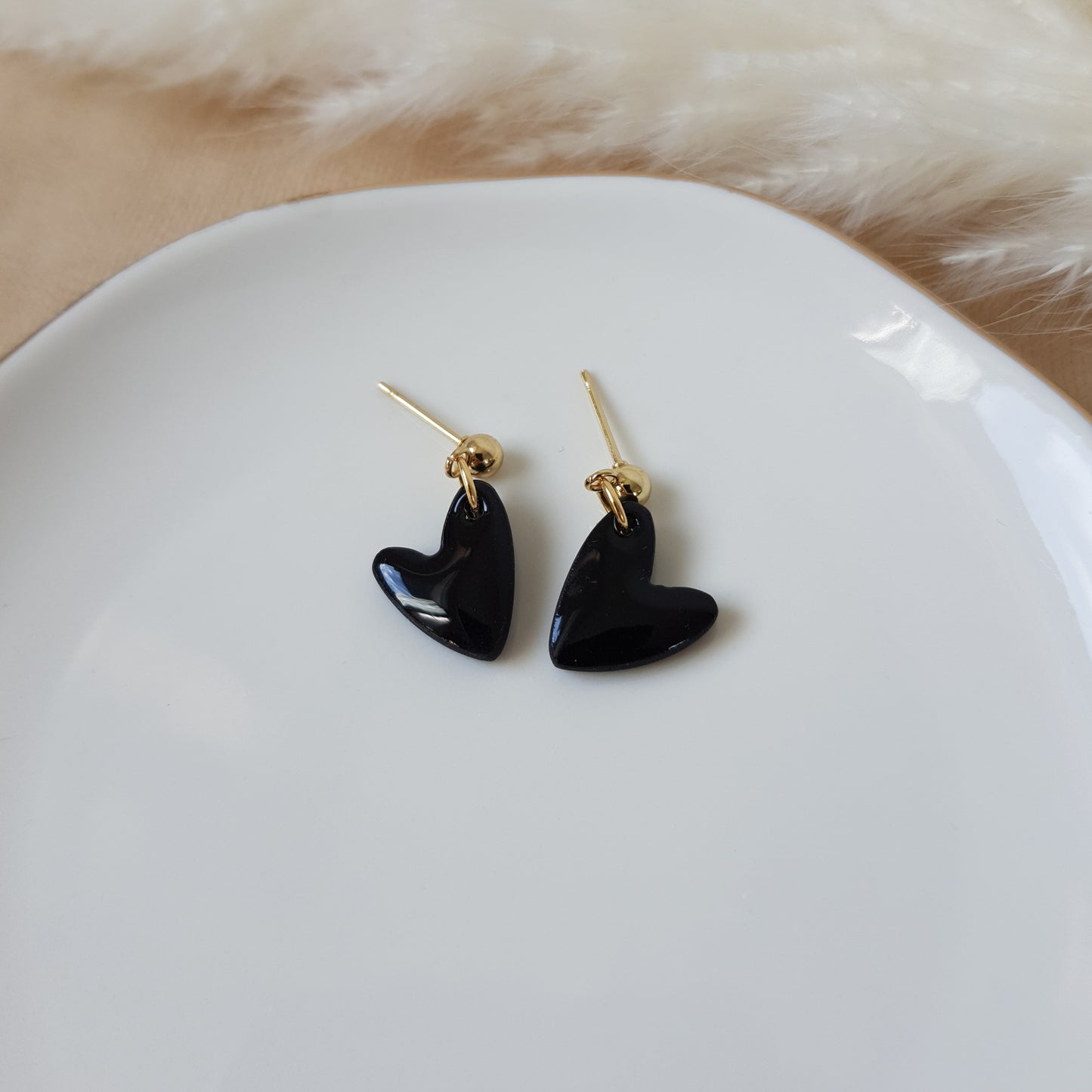 Black glossy dangle hearts