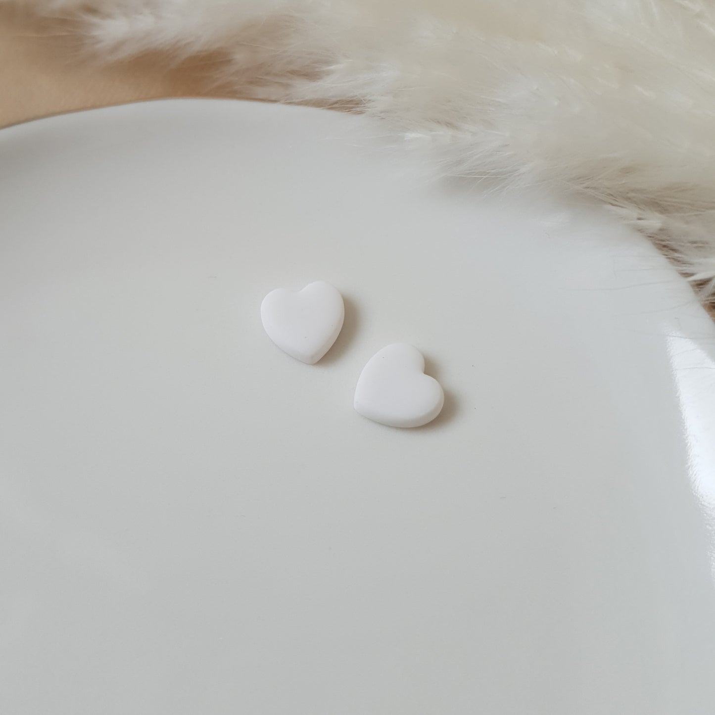 Mini white heart stud earrings
