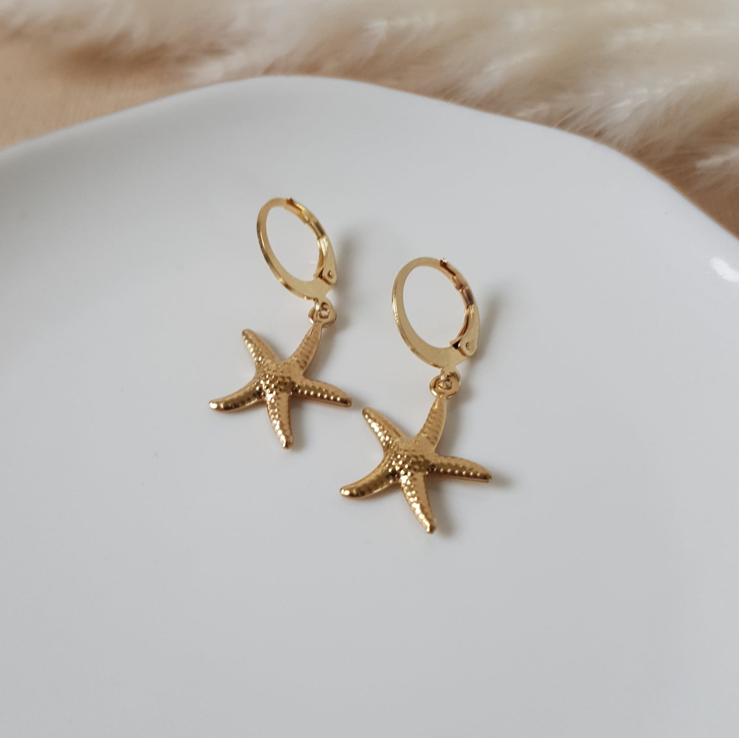 Gold sea star hoop earrings