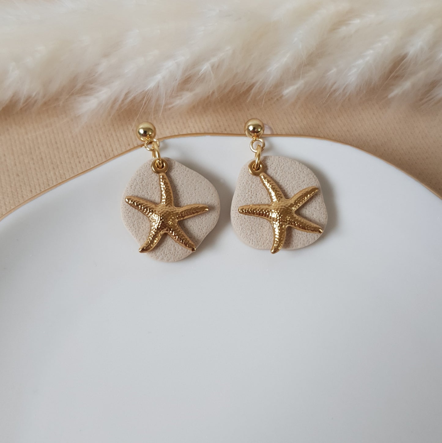 Gold stars on sand earrings