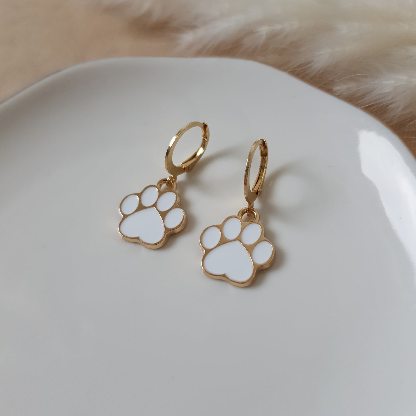 White paw earrings