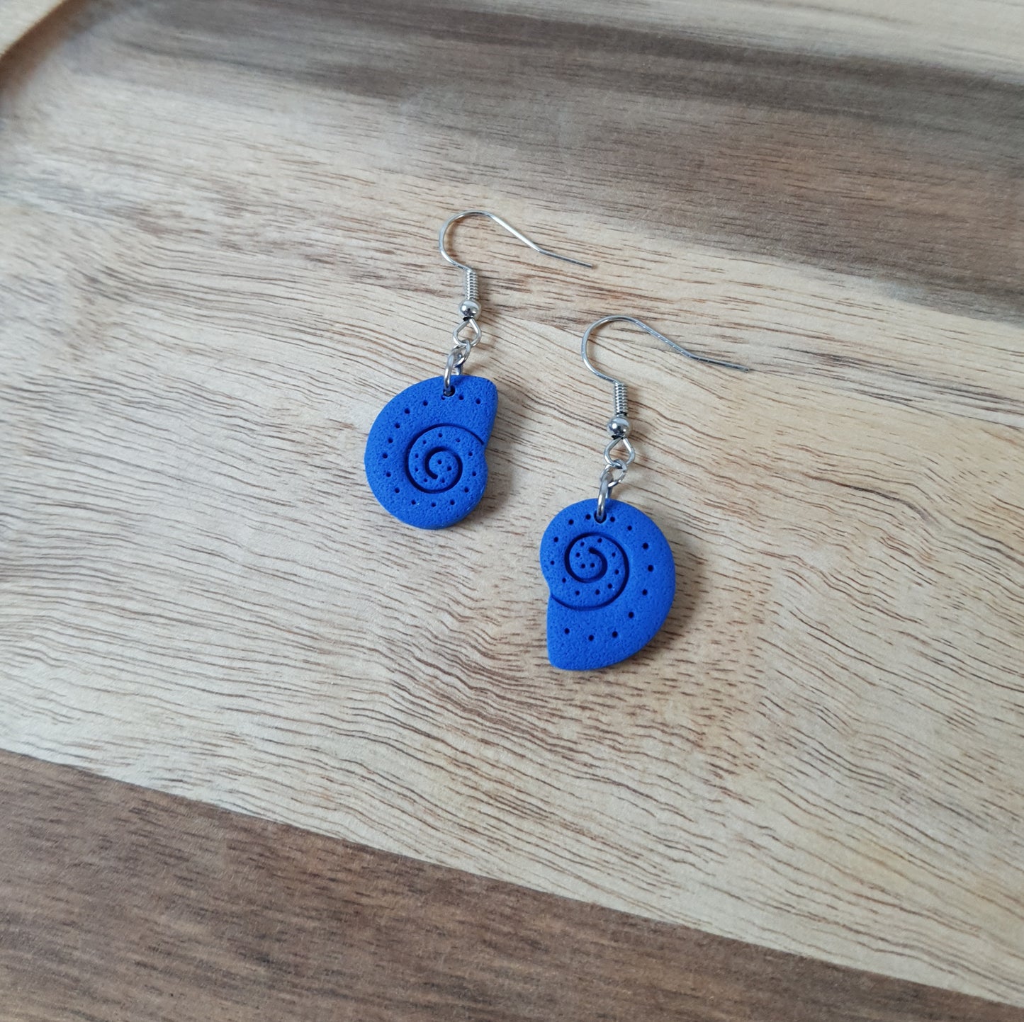 Blue snail dangle earrings
