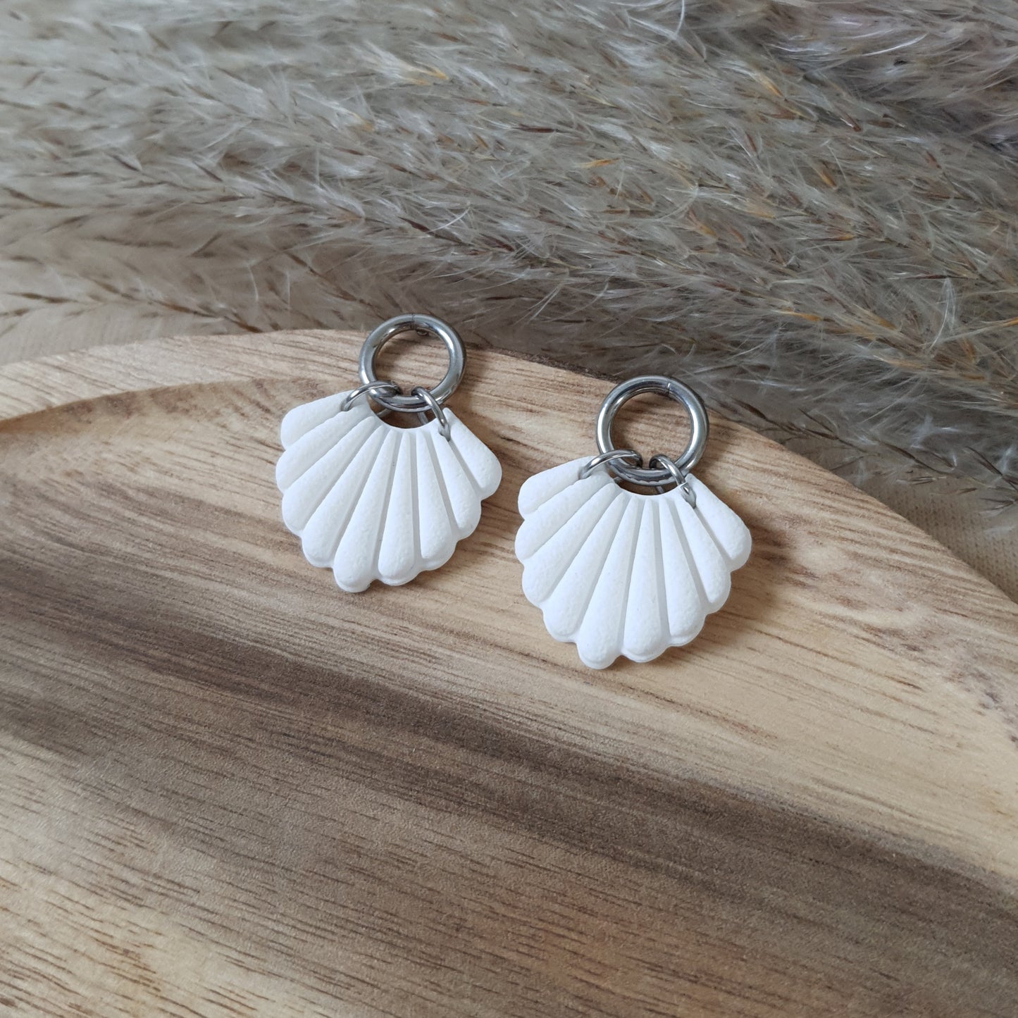 White shell and silver earrings