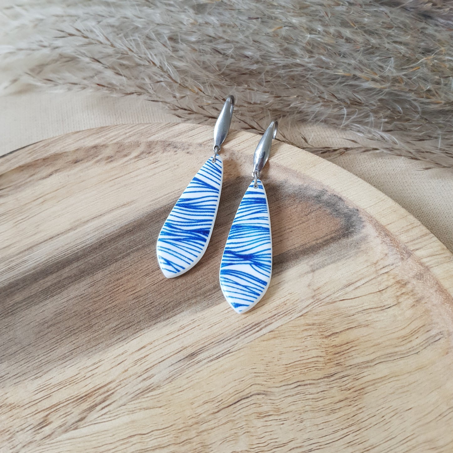 Blue waves dangle earrings