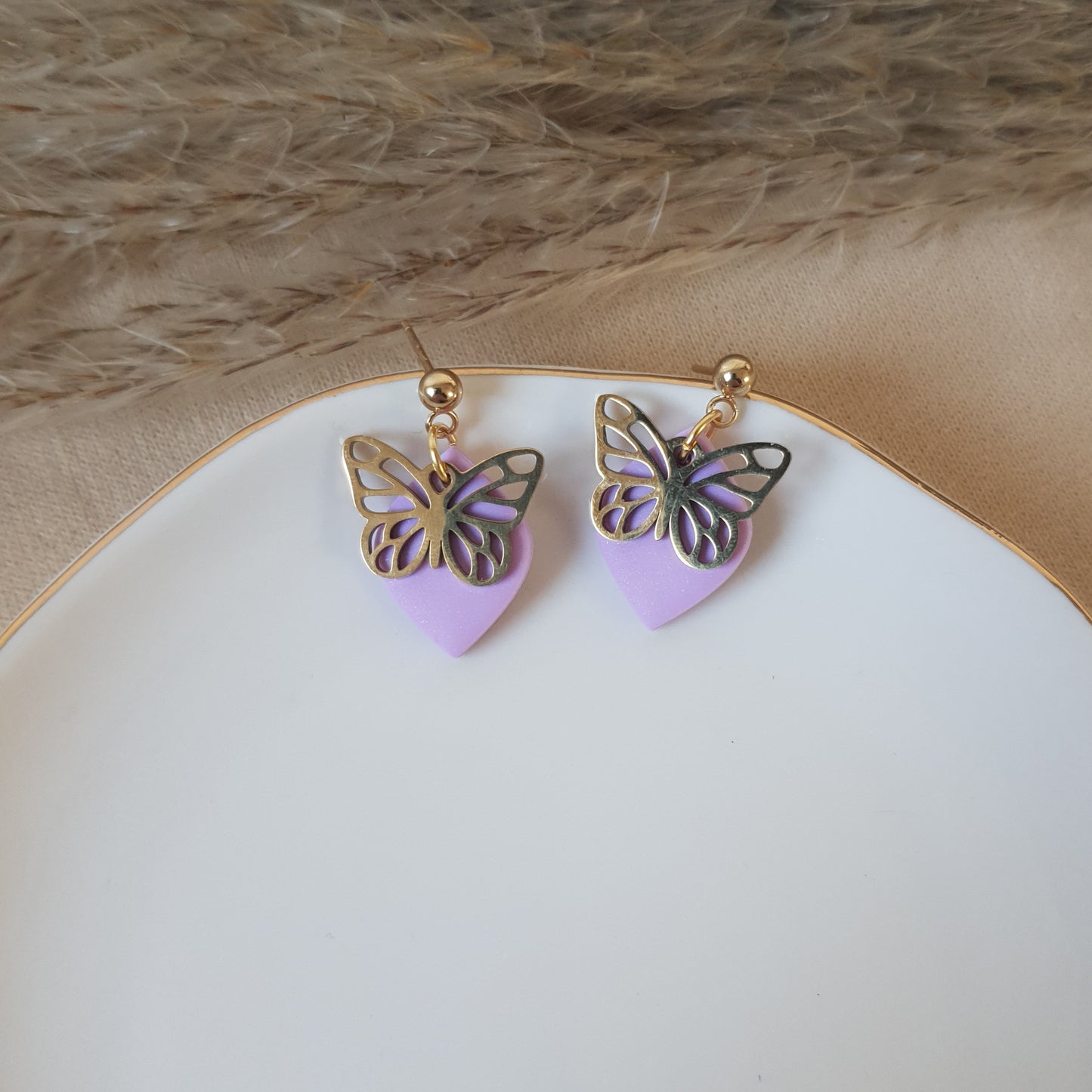 Gold butterfly dangle earrings