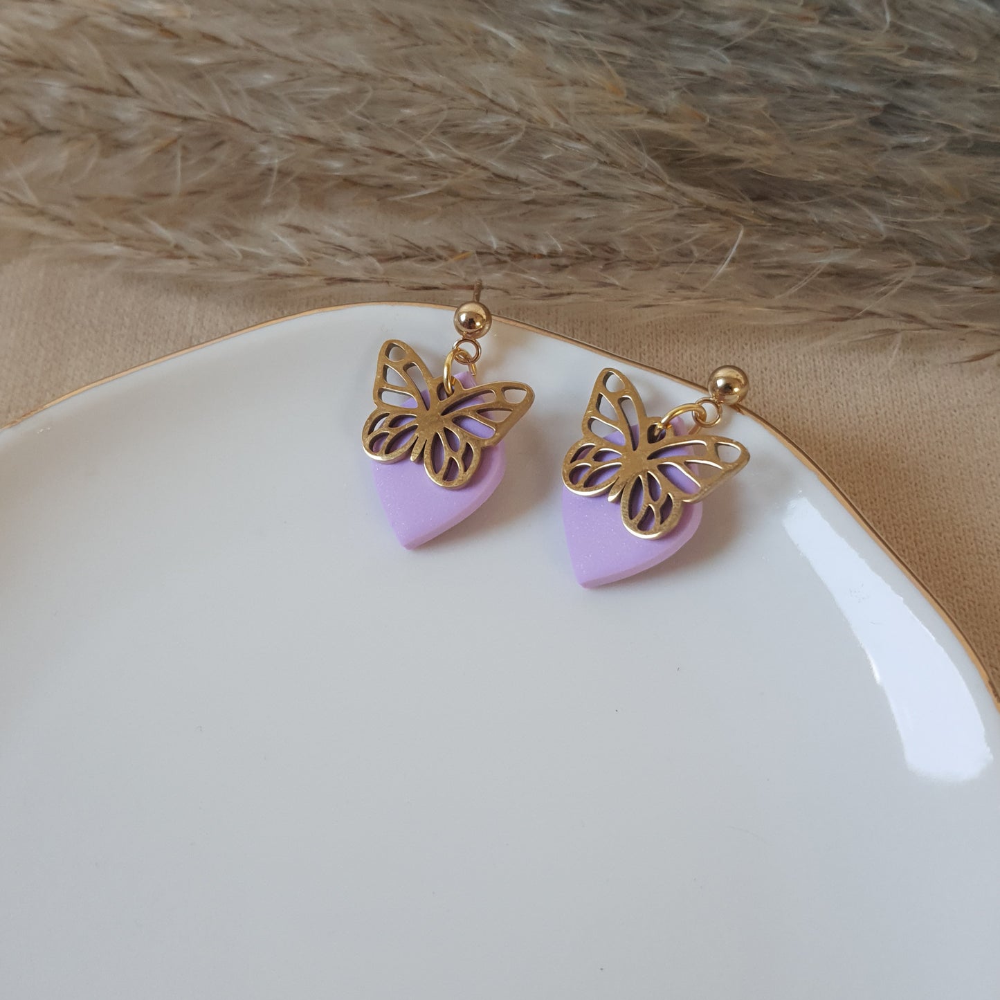 Gold butterfly dangle earrings