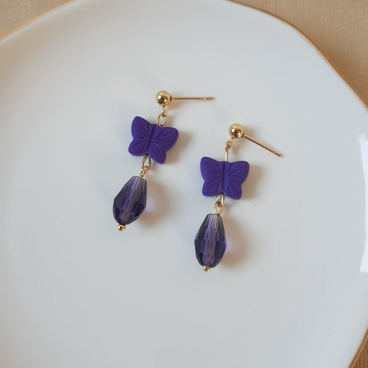 Dark purple butterfly dangle earrings