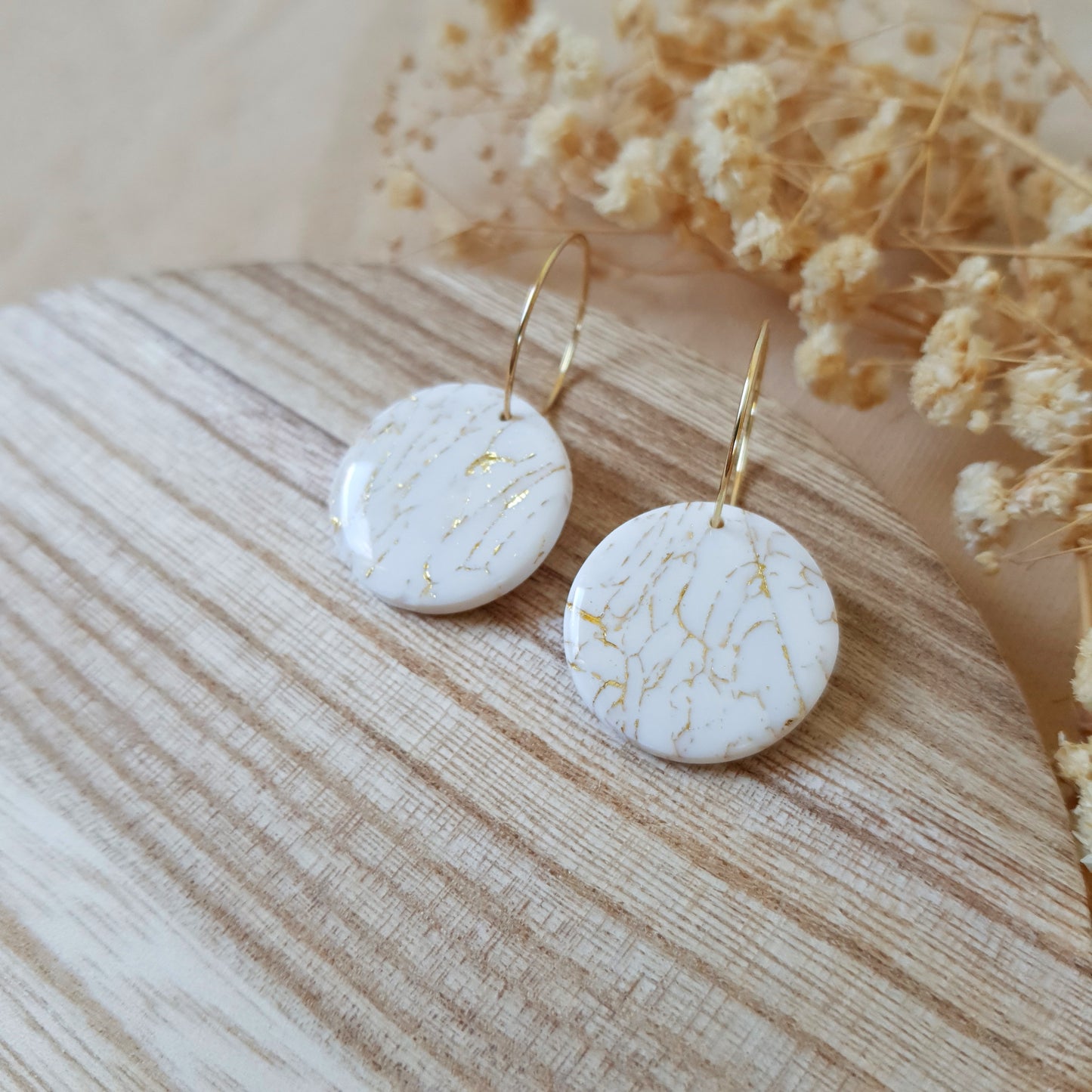 Beige and gold cracked hoops