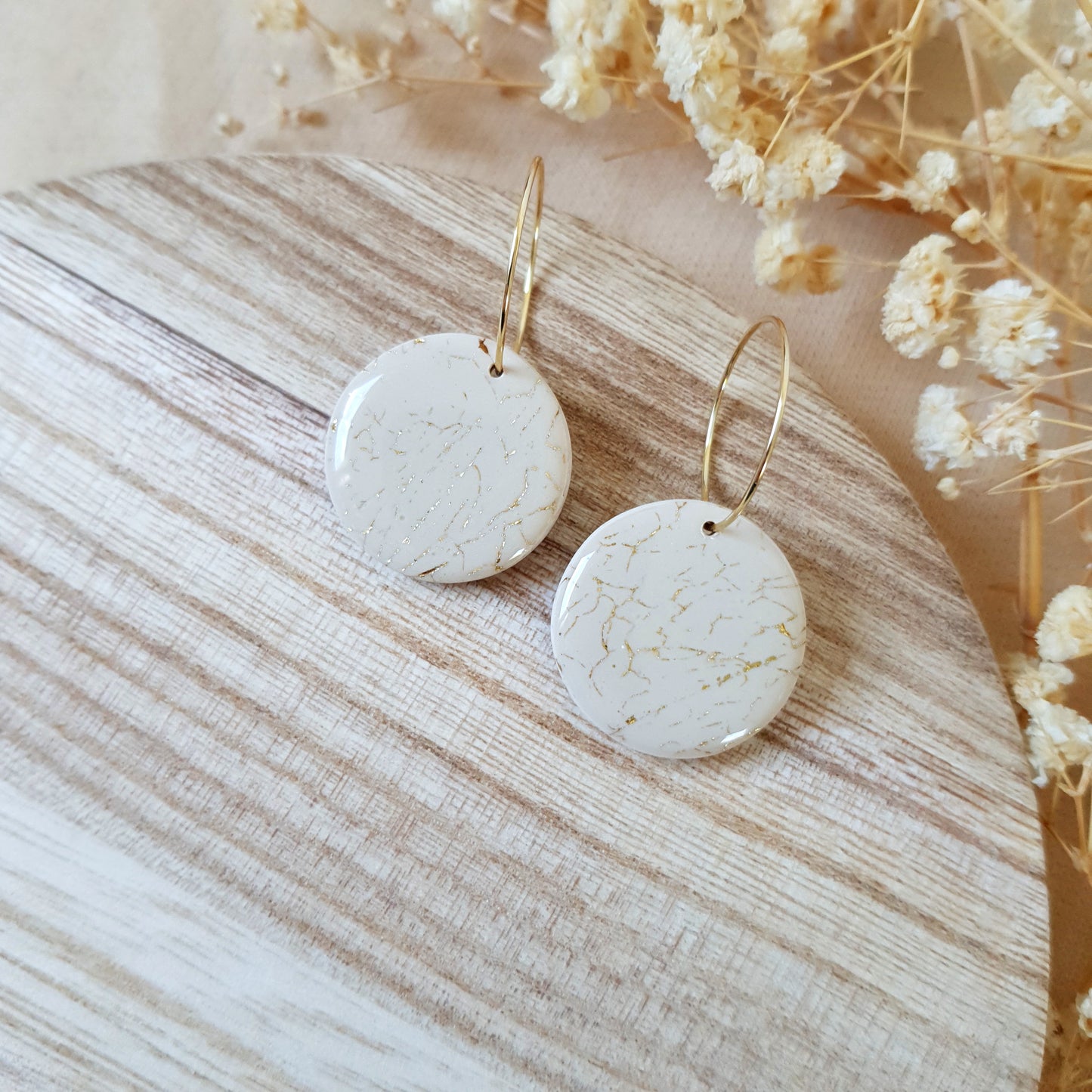Beige and gold cracked hoops