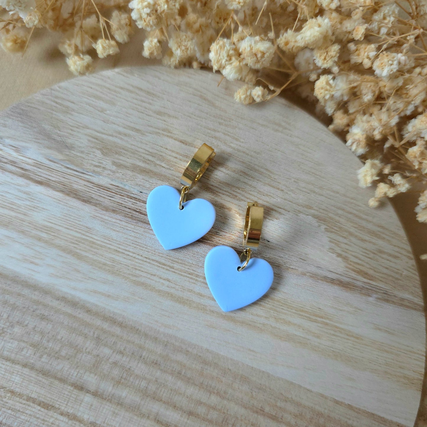 Light blue heart dangle earrings