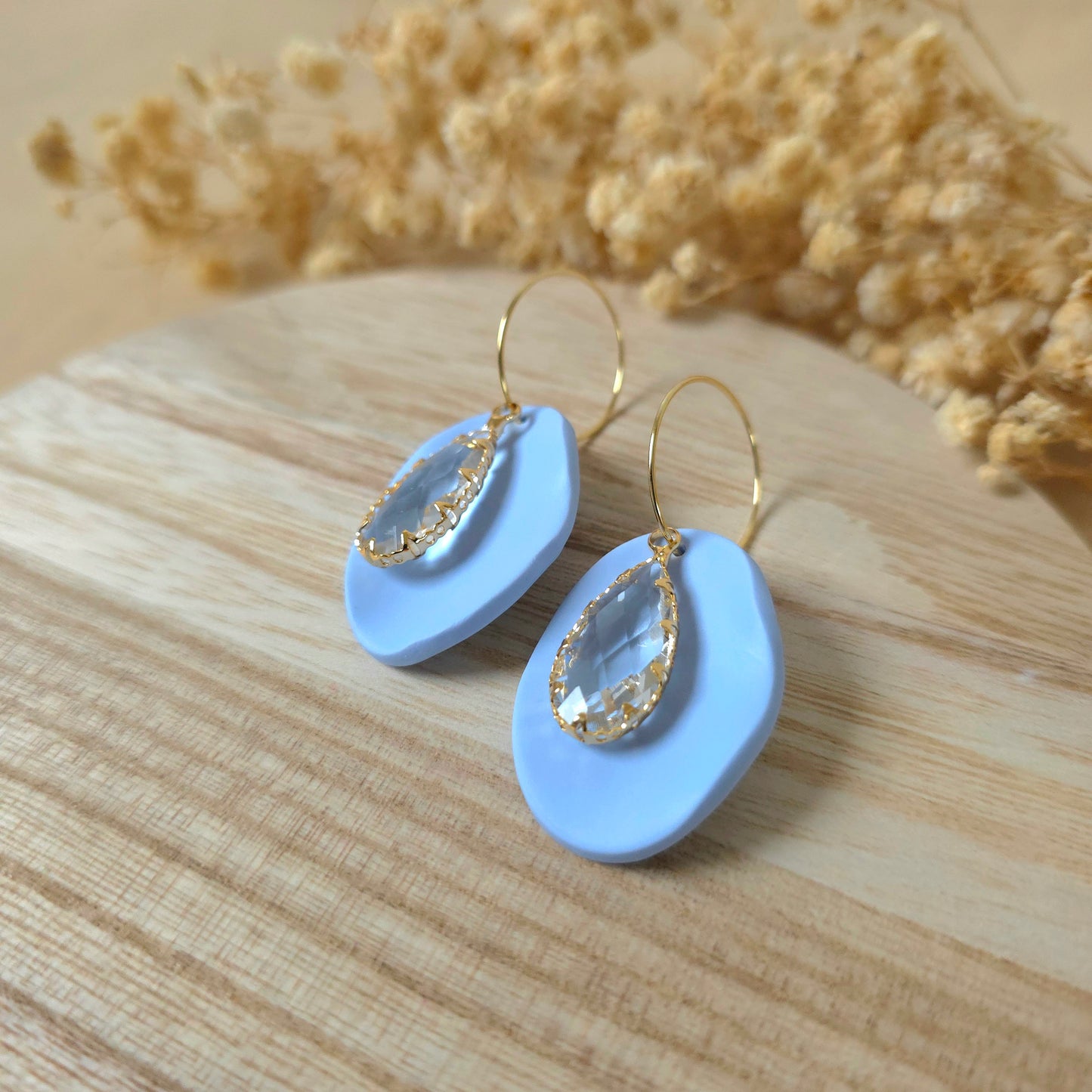 Crystal oval blue hoop earrings