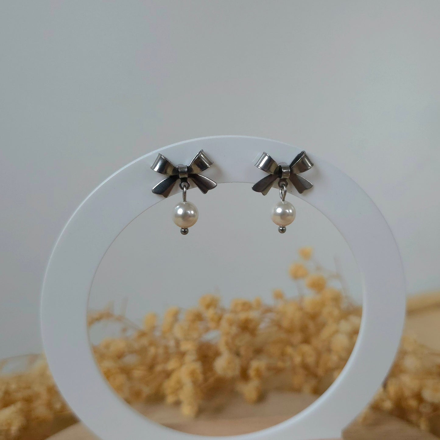 Silver bow and mini pearl earrings