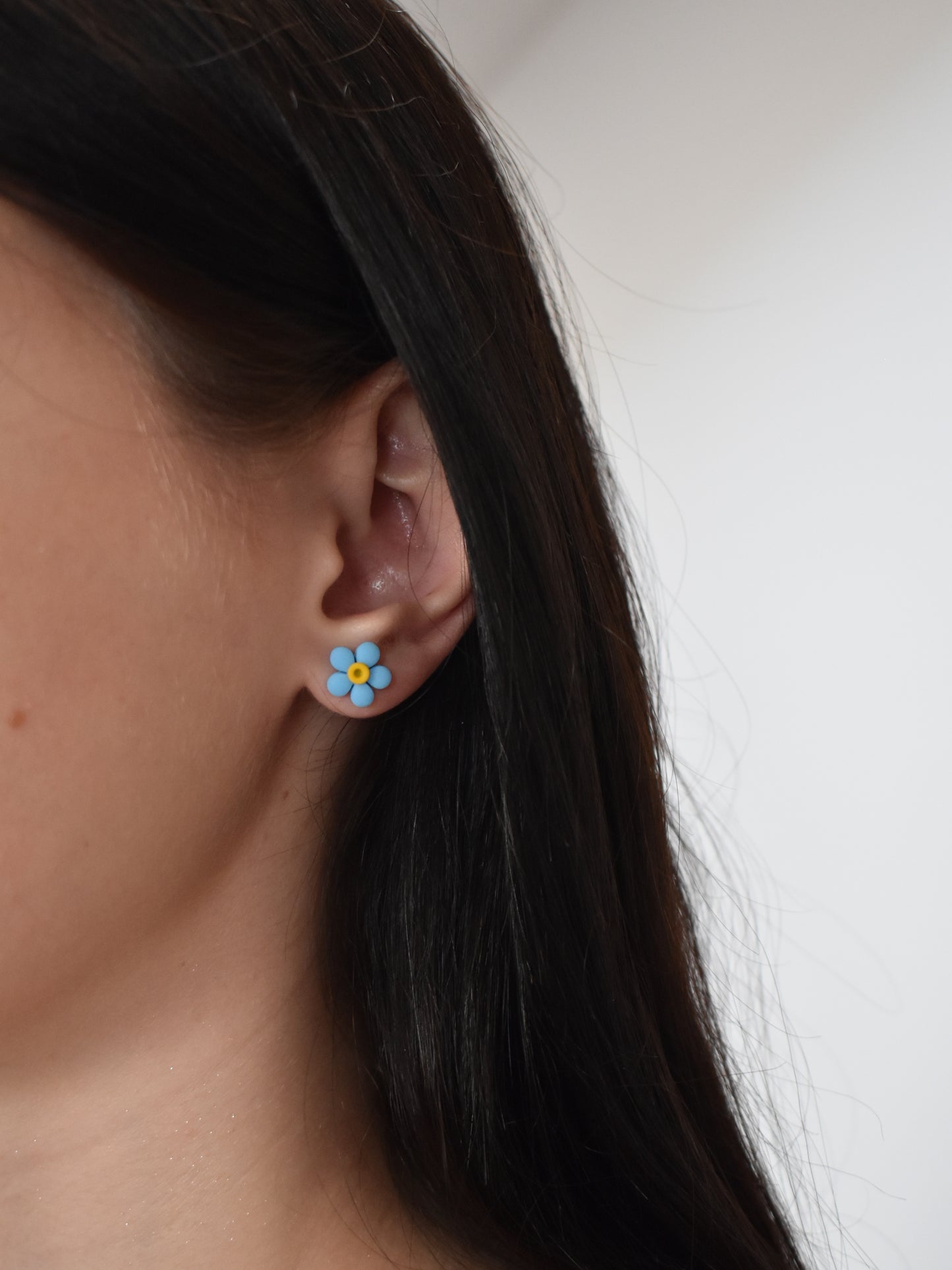Neon blue flower stud earrings
