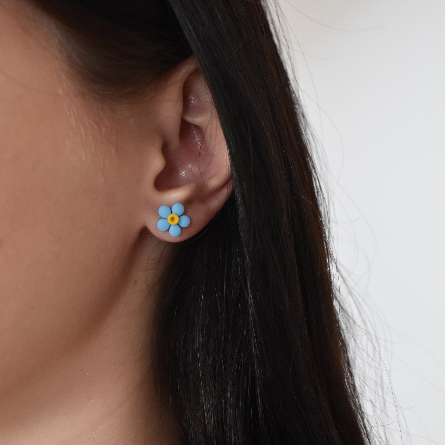Neon blue flower stud earrings