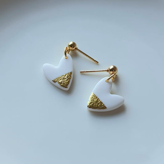 White hearts with golden flakes dangle earrings