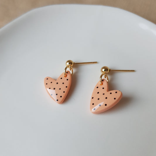 Peachy spotted dangly heart earrings