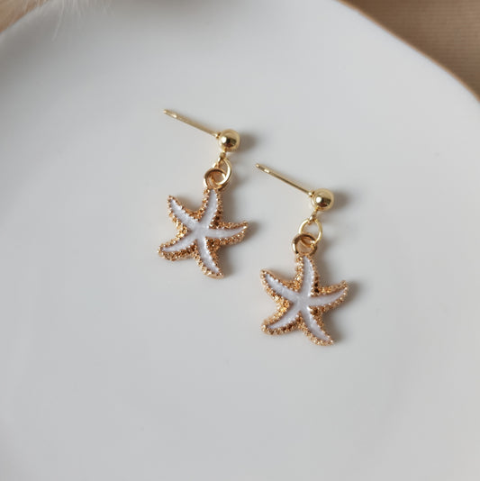 White sea star dangle earrings