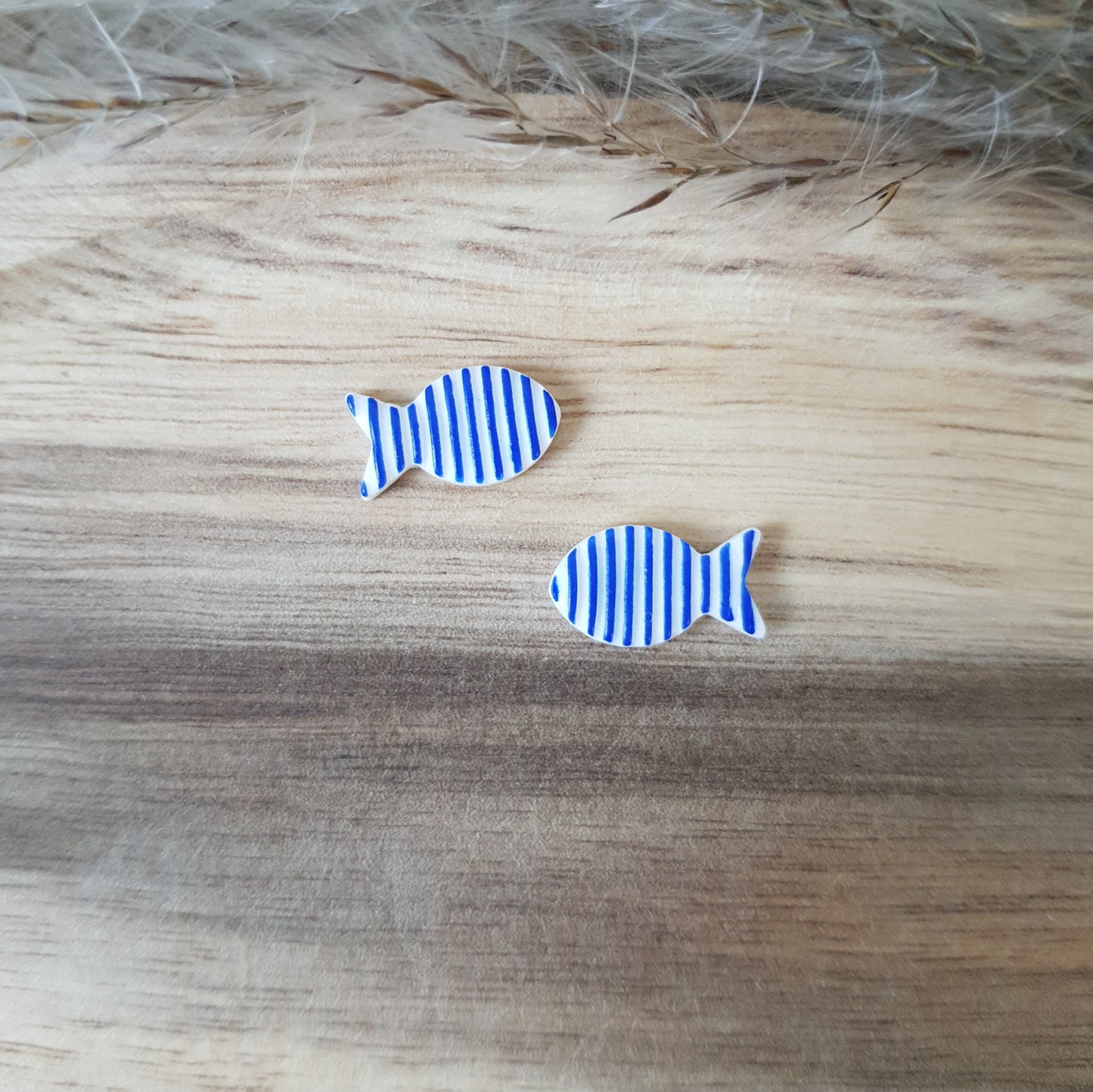 Striped fish stud earrings