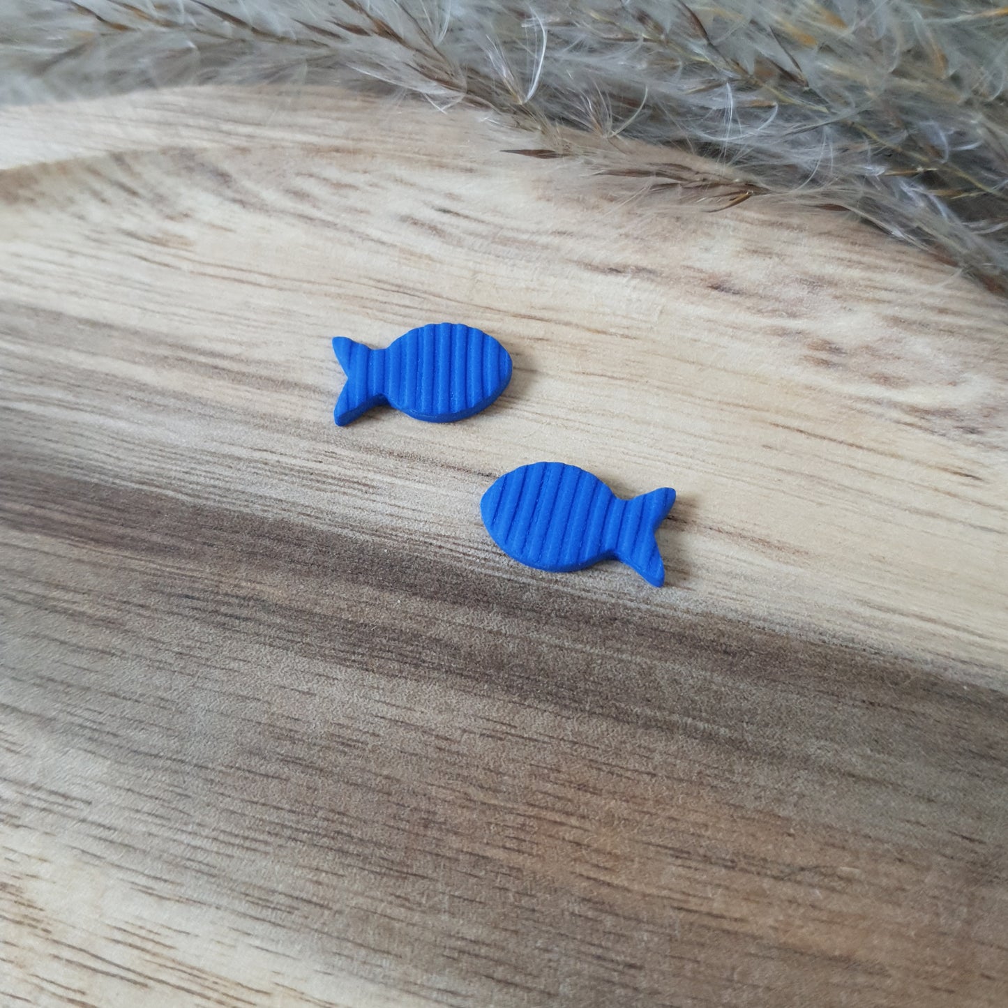 Blue fish stud earrings