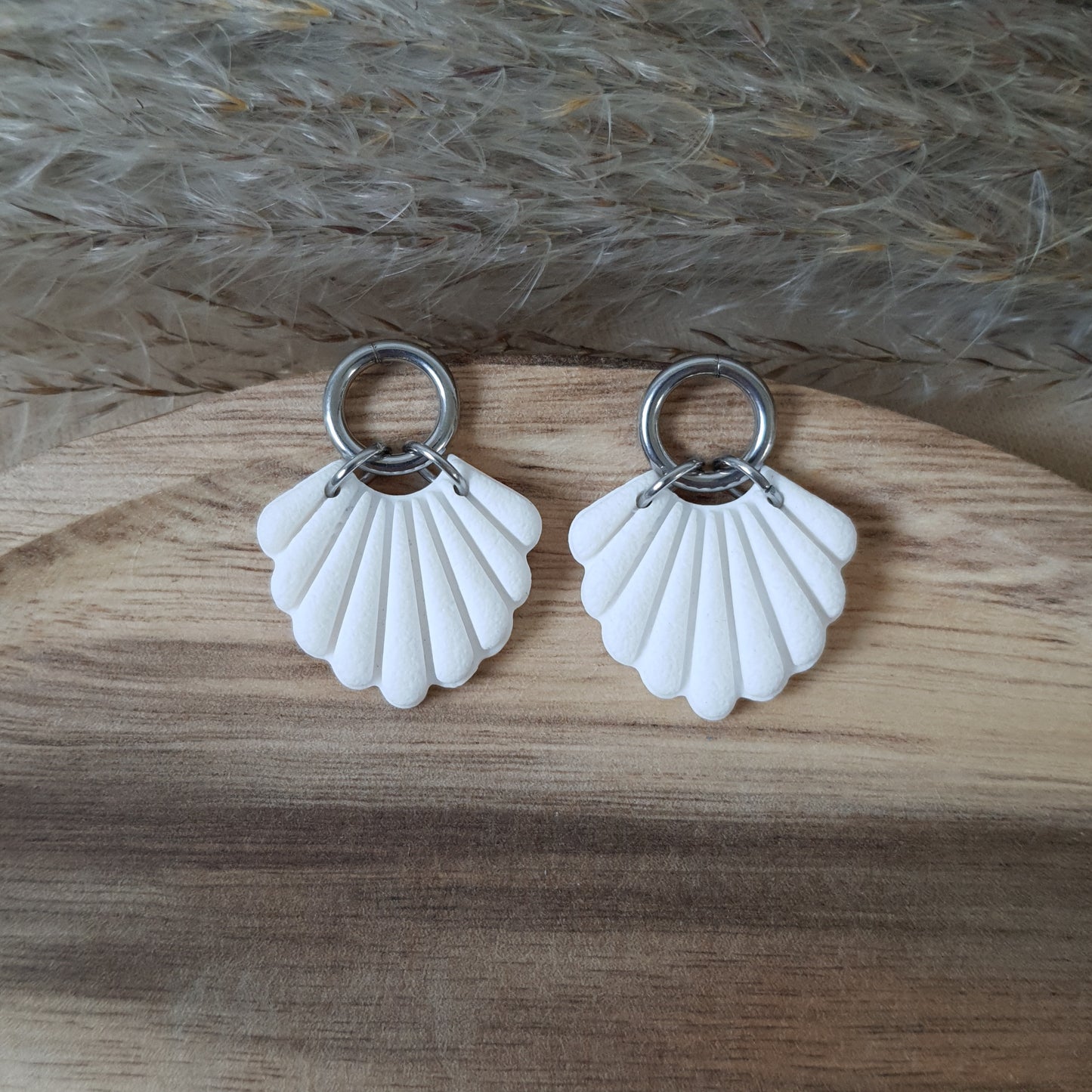 White shell and silver earrings