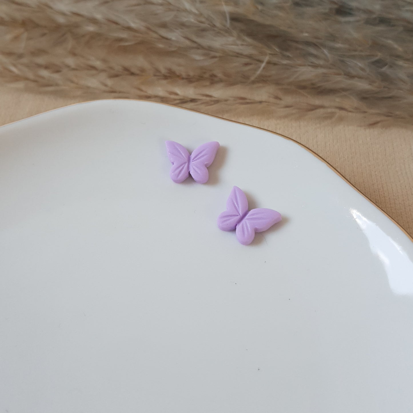 Violet butterfly studs