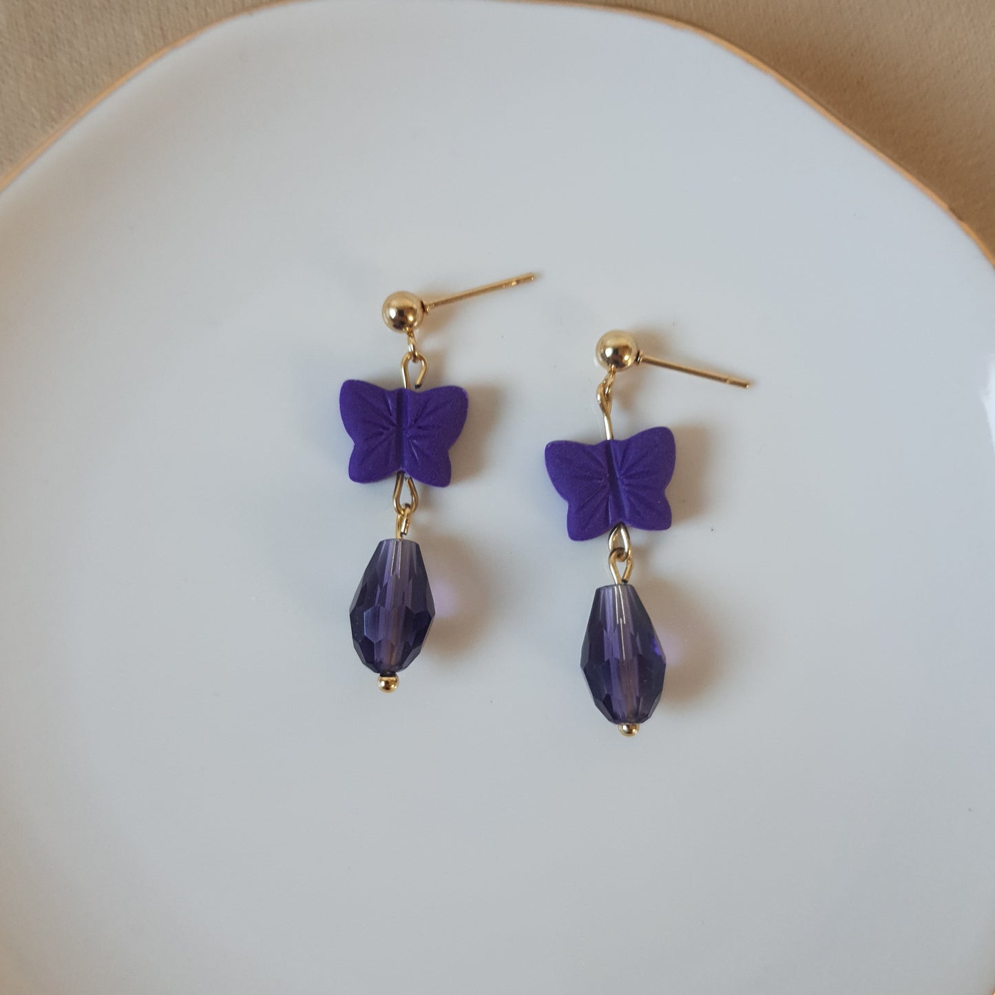 Dark purple butterfly dangle earrings