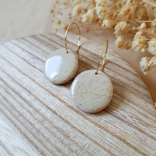 Beige and gold cracked hoops