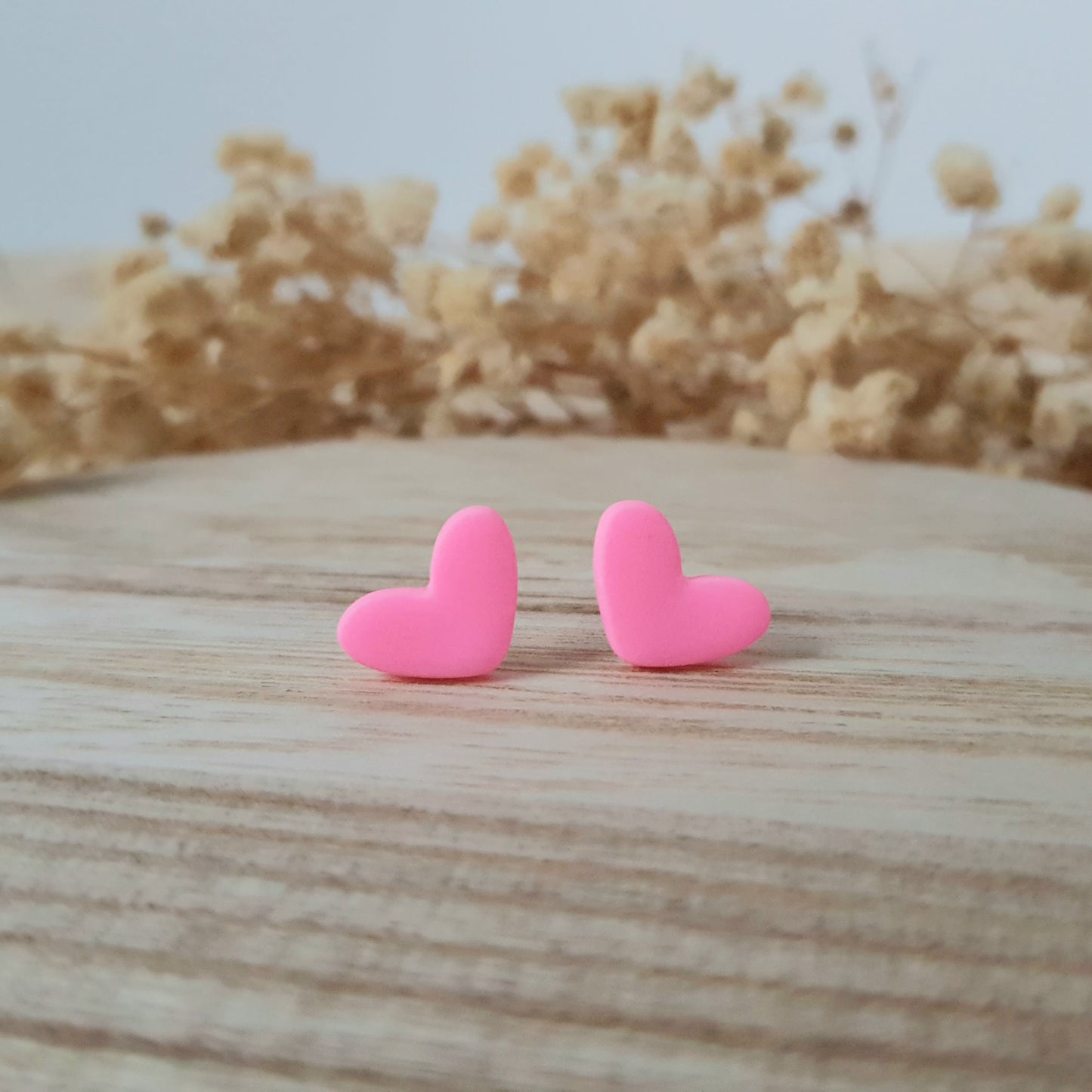 Neon pink heart earrings
