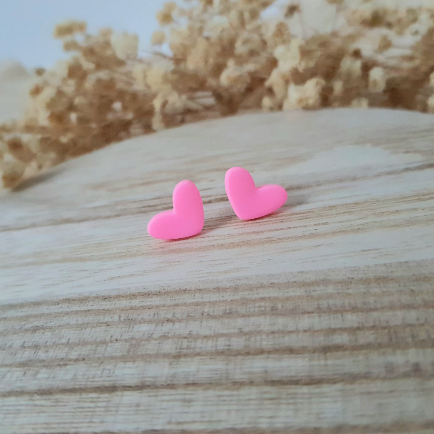 Neon pink heart earrings