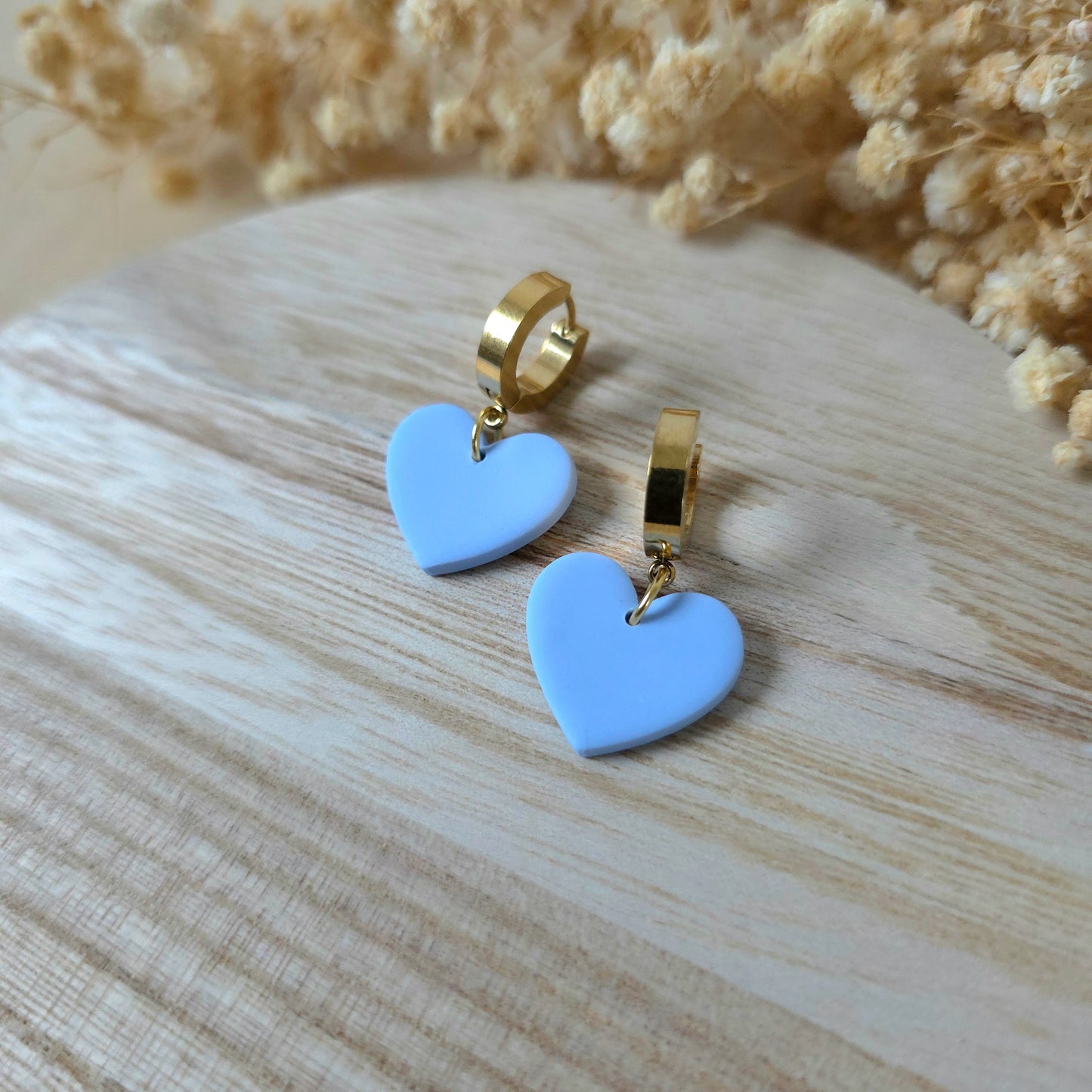 Light blue heart dangle earrings