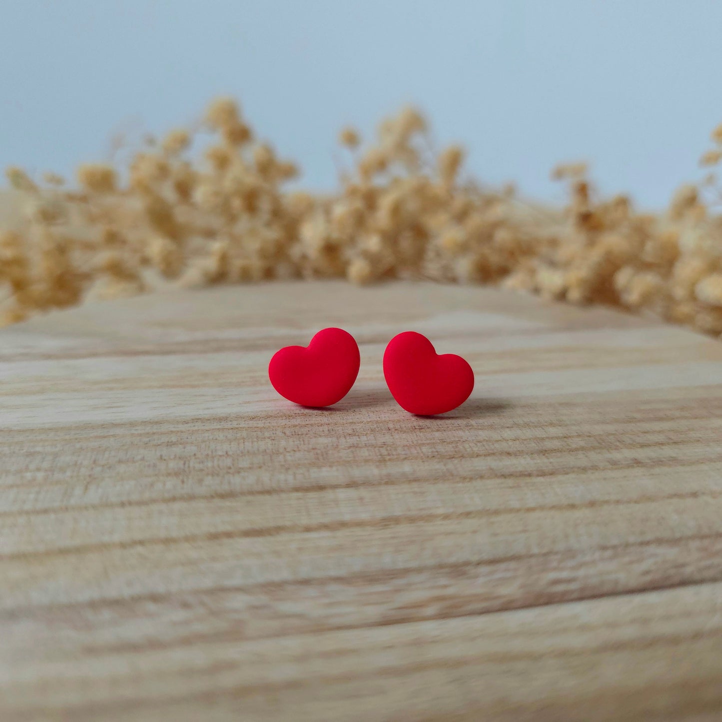 Wide red heart stud earrings