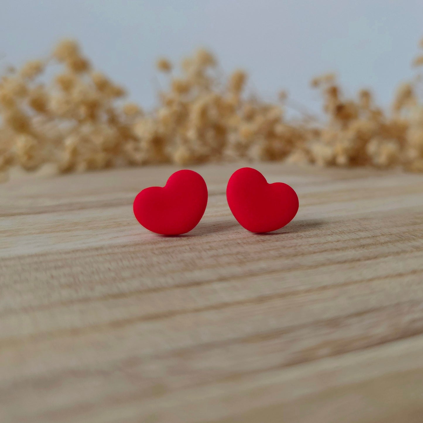 Wide red heart stud earrings