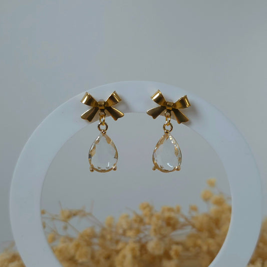 Golden bow and clear drop dangle earrings