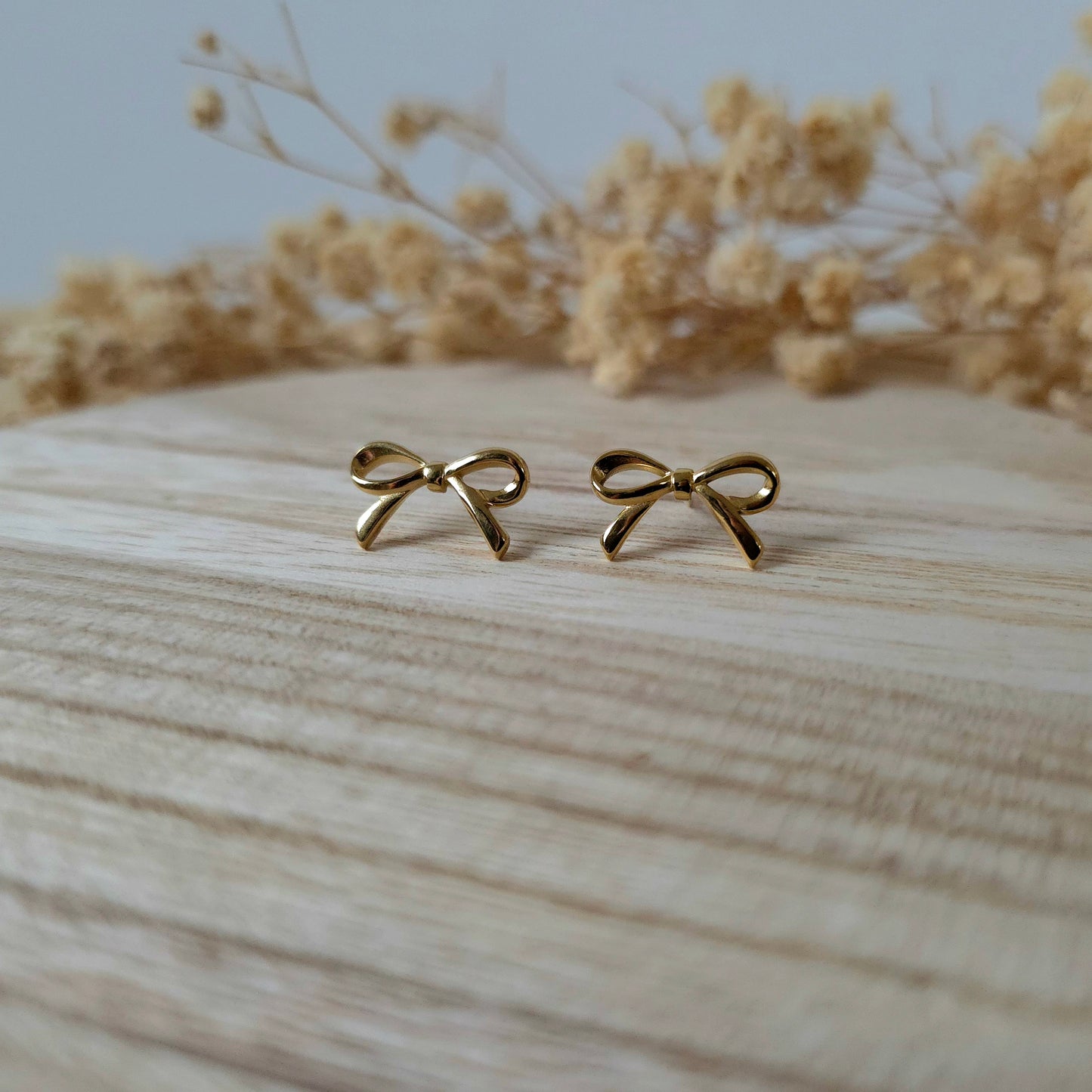 Golden bow stud earrings