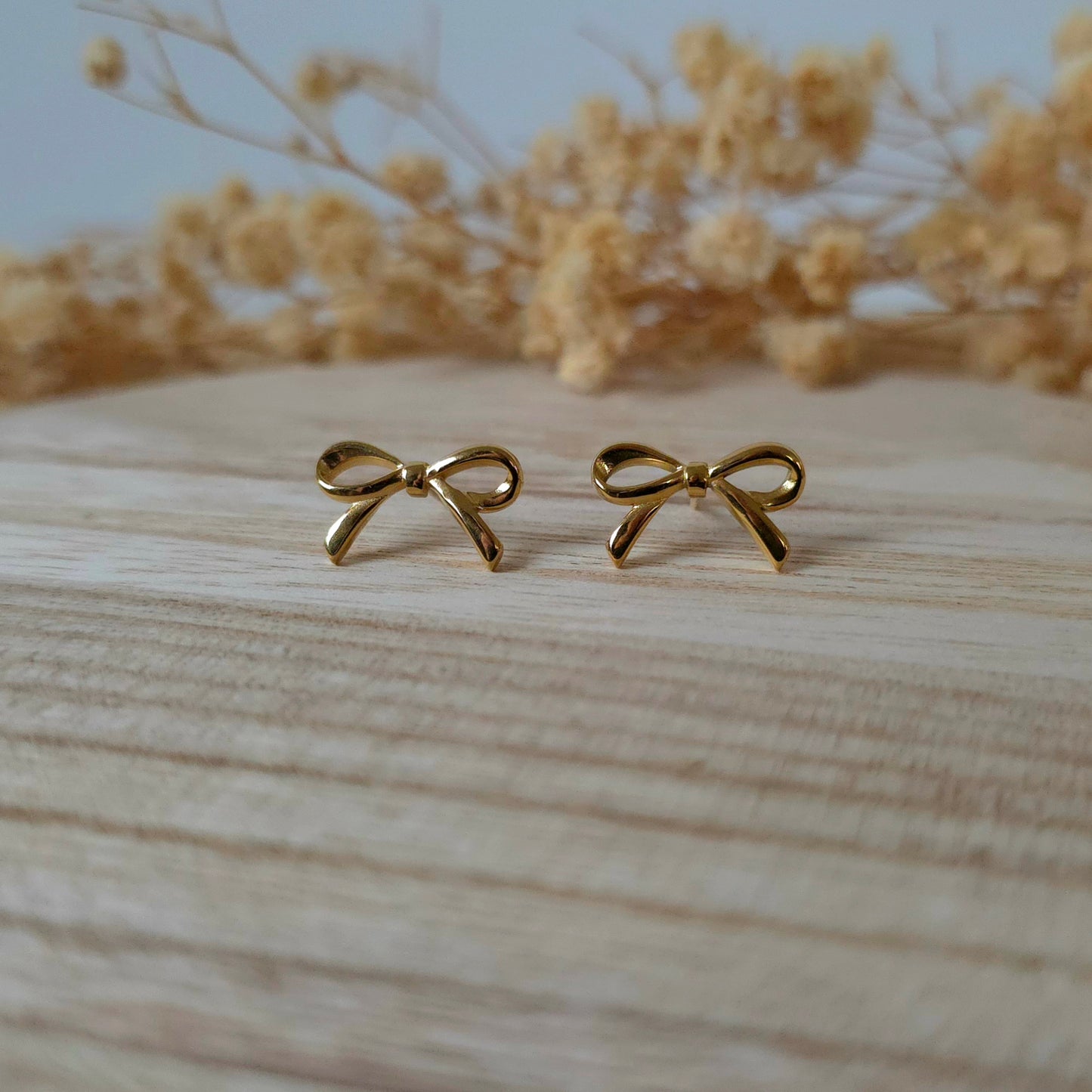 Golden bow stud earrings